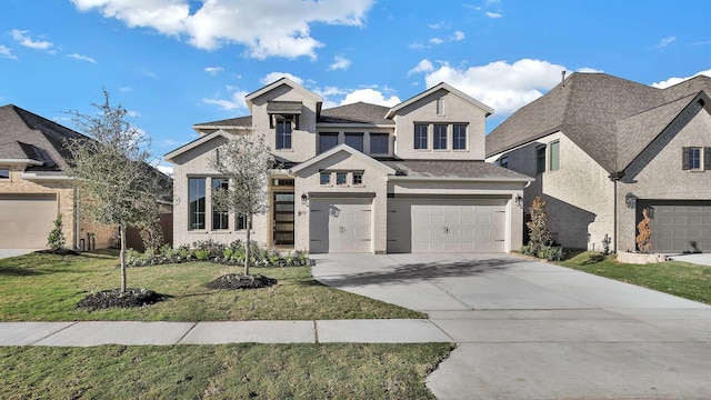 view of front of property with a garage and a front lawn