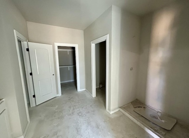 interior space featuring a walk in closet and a closet