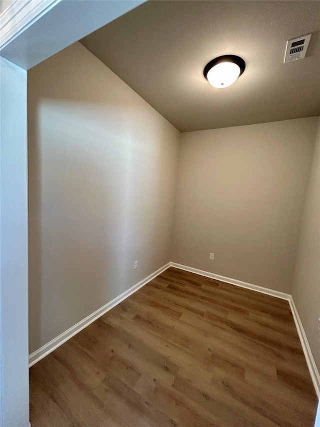 spare room featuring hardwood / wood-style floors