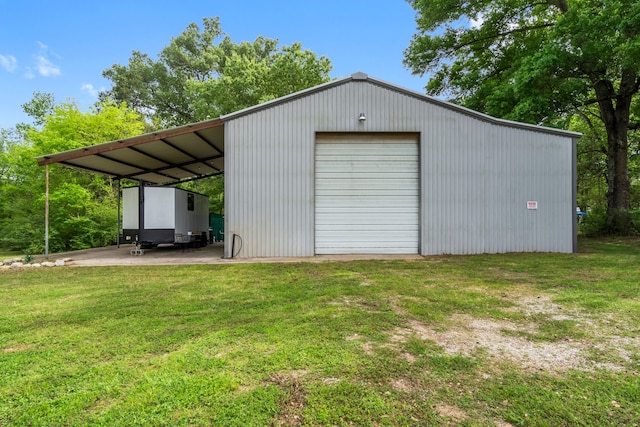 garage featuring a lawn