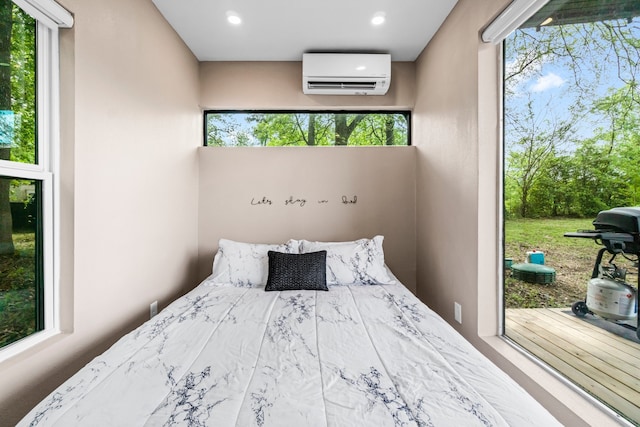 unfurnished bedroom featuring an AC wall unit