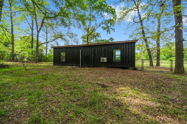 view of outdoor structure with a lawn