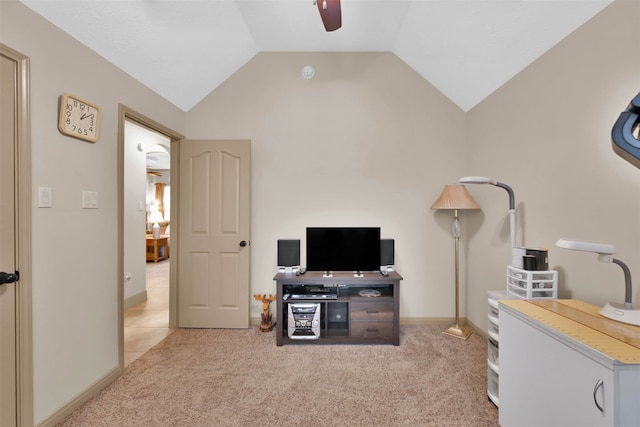 interior space with ceiling fan, light carpet, and lofted ceiling