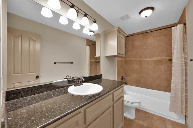 full bathroom featuring tile patterned flooring, shower / bath combination with curtain, toilet, and vanity