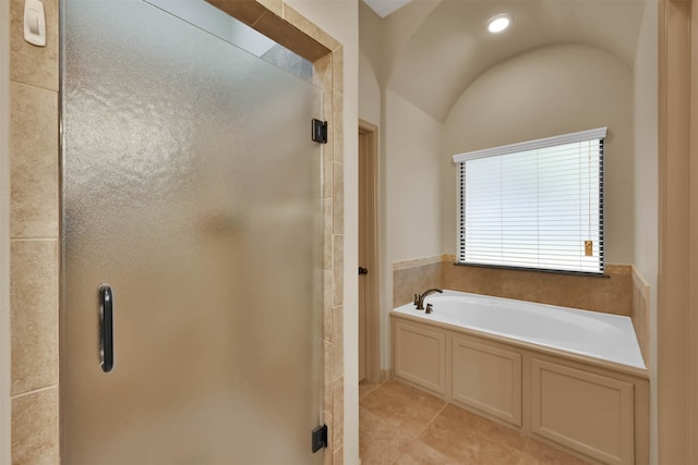 bathroom featuring tile patterned floors, vaulted ceiling, and separate shower and tub