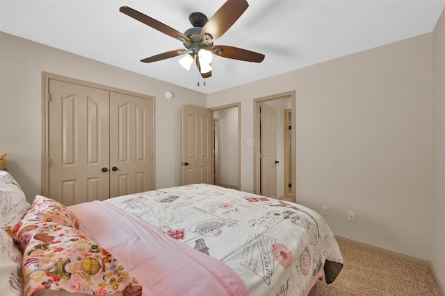 carpeted bedroom with a closet and ceiling fan