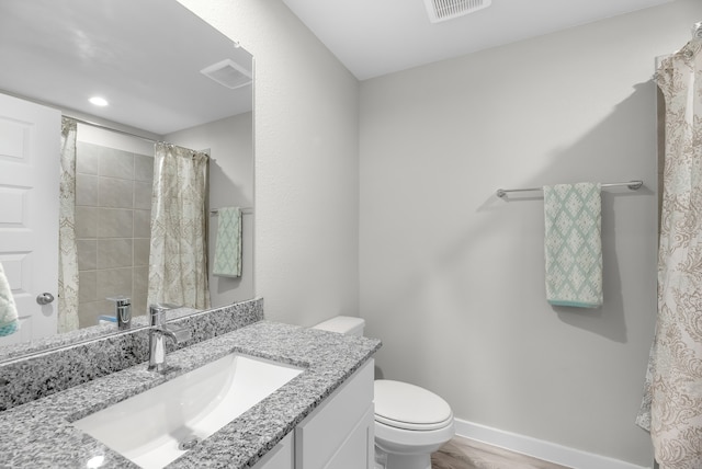 bathroom featuring toilet, vanity, wood-type flooring, and a shower with shower curtain