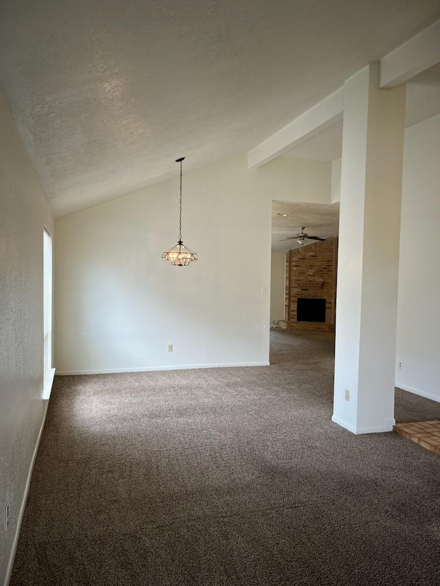 10506 Twilight Moon Dr, Houston, TX 77064 - empty room featuring lofted ceiling, dark colored carpet, baseboards, a fireplace, and a ceiling fan
