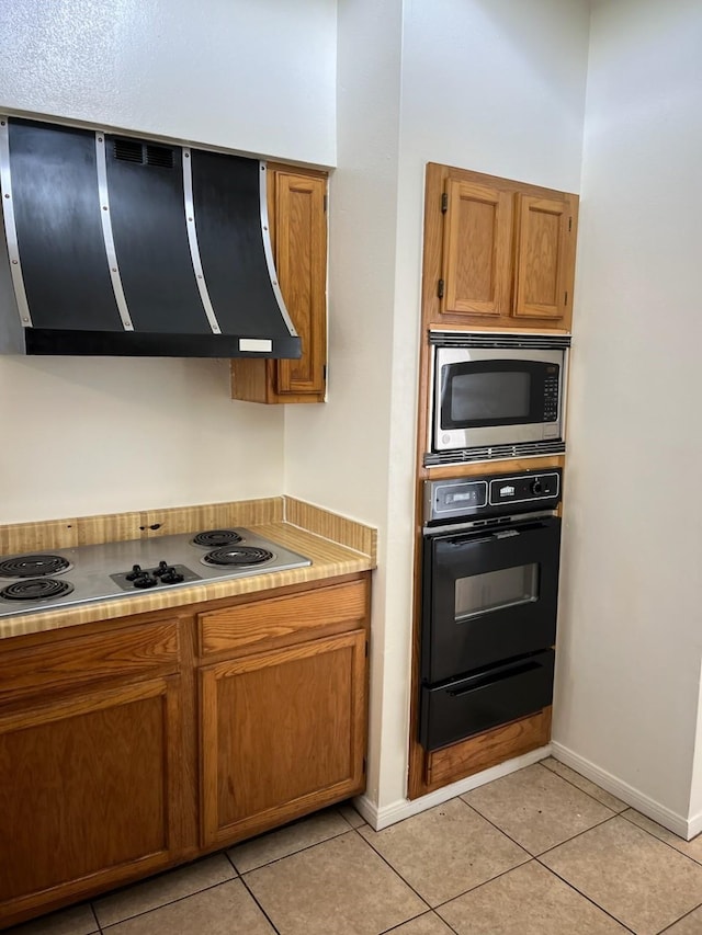 10506 Twilight Moon Dr, Houston, TX 77064 - kitchen featuring appliances with stainless steel finishes, exhaust hood, a warming drawer, and brown cabinets