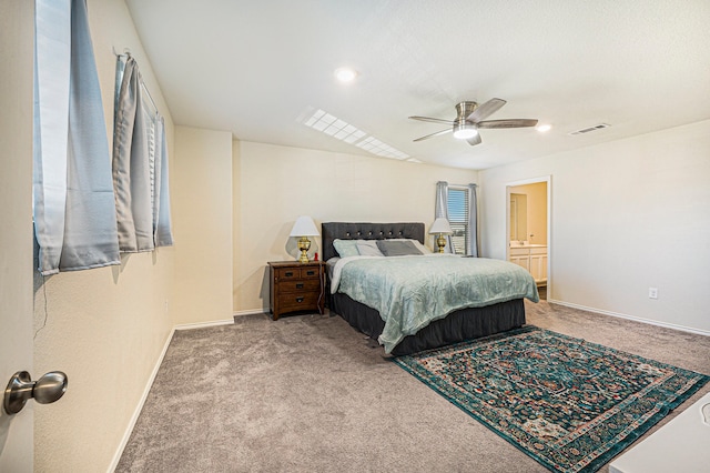 carpeted bedroom featuring connected bathroom and ceiling fan