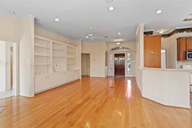 unfurnished living room featuring light hardwood / wood-style floors, crown molding, built in shelves, and ceiling fan