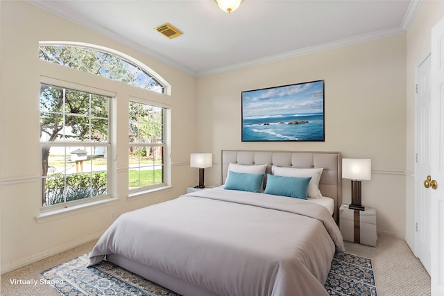 carpeted bedroom featuring crown molding