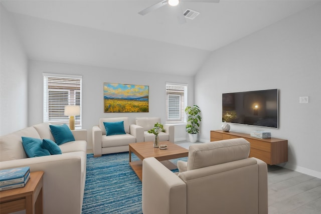 living room with light hardwood / wood-style flooring, lofted ceiling, and ceiling fan