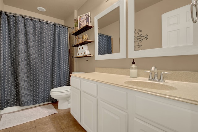 bathroom featuring vanity, a shower with shower curtain, toilet, and tile patterned flooring