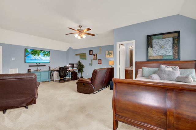 bedroom featuring connected bathroom, light colored carpet, lofted ceiling, and ceiling fan