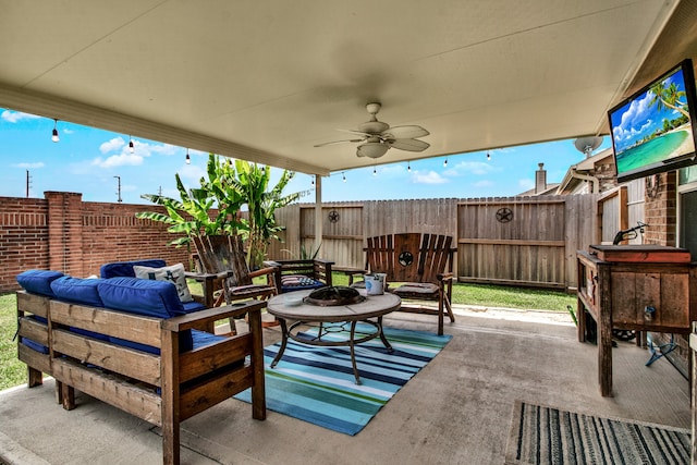 view of patio featuring a fire pit and ceiling fan