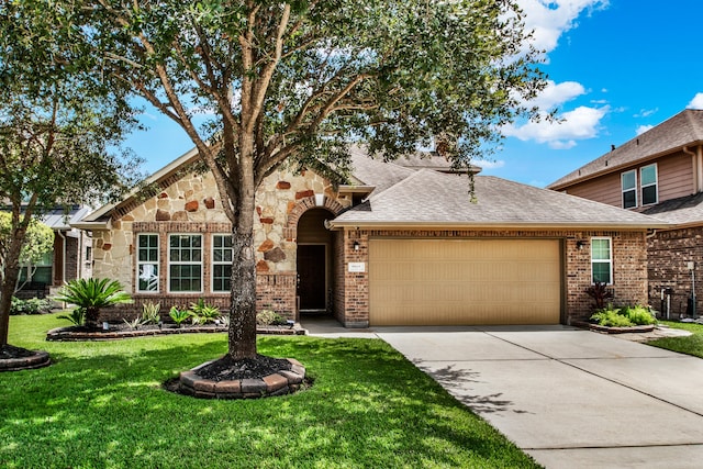 view of front of property with a front lawn and a garage