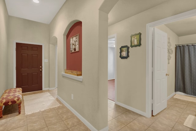 entrance foyer featuring light tile patterned flooring