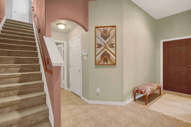 entryway with light tile patterned floors