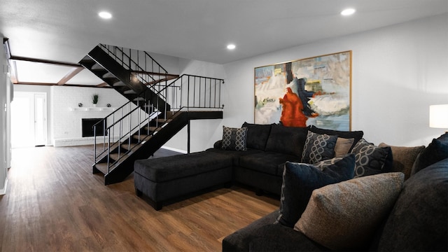 living room with a fireplace and hardwood / wood-style flooring