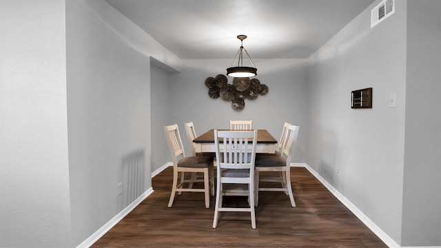 dining room featuring dark hardwood / wood-style flooring