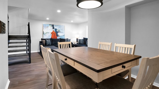 dining area featuring dark hardwood / wood-style floors