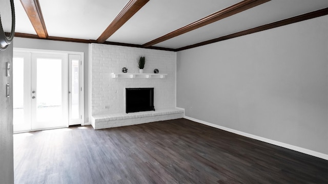 unfurnished living room with beamed ceiling, dark hardwood / wood-style flooring, and a fireplace