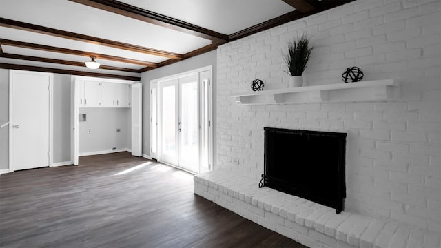 unfurnished living room with french doors, hardwood / wood-style floors, beamed ceiling, and crown molding