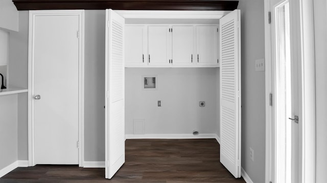 washroom featuring cabinets, hookup for an electric dryer, washer hookup, and dark wood-type flooring