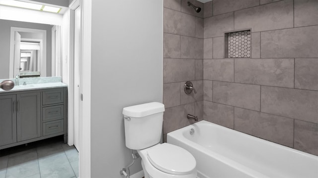 full bathroom with vanity, toilet, tiled shower / bath combo, and tile patterned flooring