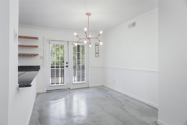 unfurnished dining area with concrete floors, ornamental molding, a chandelier, and french doors