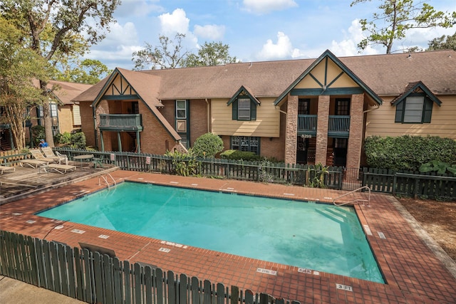 view of swimming pool with a patio