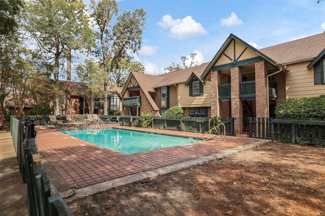 view of pool featuring a patio