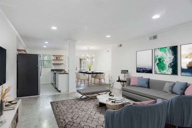 living room featuring crown molding and an inviting chandelier