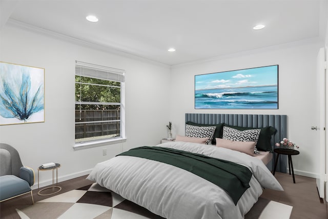 bedroom featuring ornamental molding and wood-type flooring