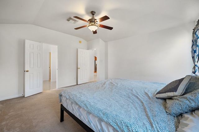 bedroom featuring ceiling fan, light carpet, and vaulted ceiling