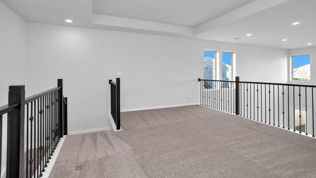 interior space featuring carpet flooring and plenty of natural light