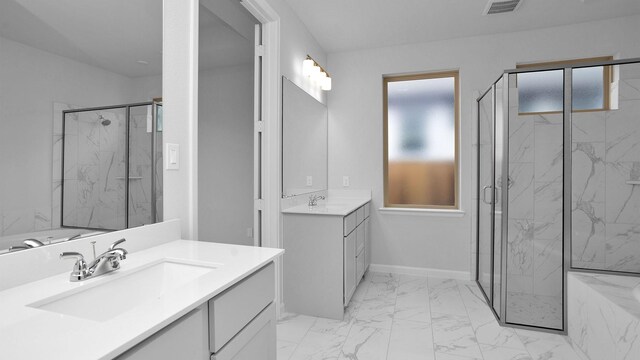 bathroom featuring vanity and a shower with shower door