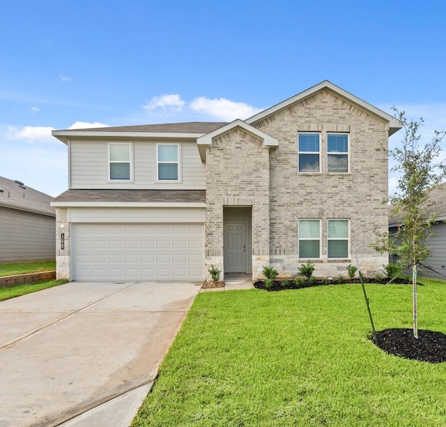 front of property featuring a garage and a front lawn