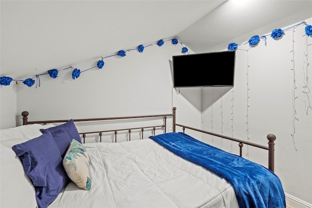 bedroom with lofted ceiling