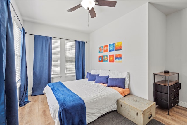 bedroom featuring light hardwood / wood-style floors and ceiling fan