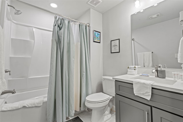 full bathroom featuring toilet, shower / bath combo with shower curtain, and vanity