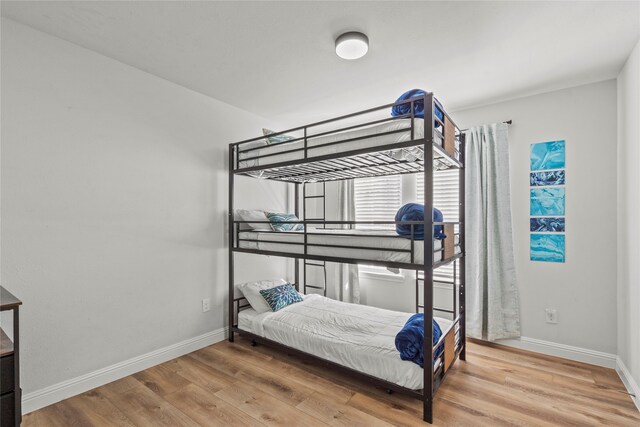 bedroom featuring hardwood / wood-style floors