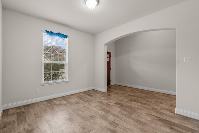 empty room with light hardwood / wood-style floors