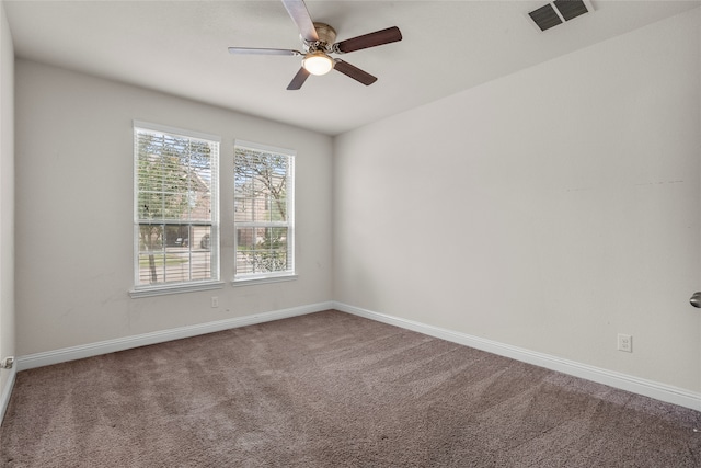 unfurnished room with carpet and ceiling fan