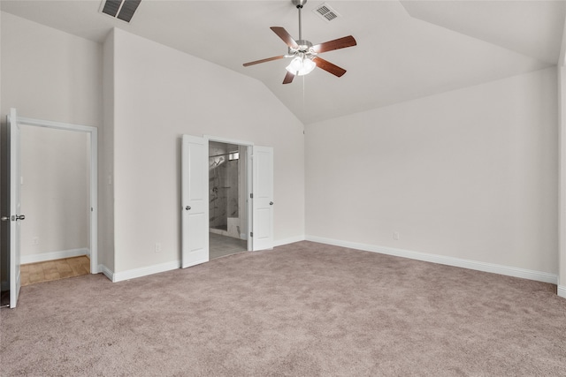 unfurnished bedroom featuring light carpet, high vaulted ceiling, connected bathroom, and ceiling fan