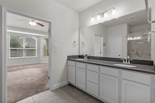 bathroom featuring vanity, ceiling fan, tile patterned floors, and a shower with door