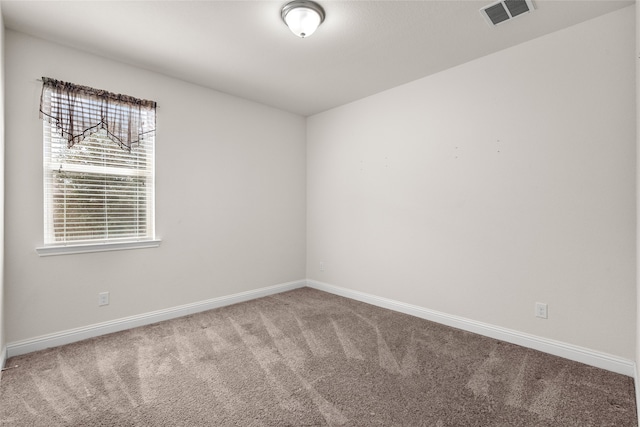 view of carpeted spare room