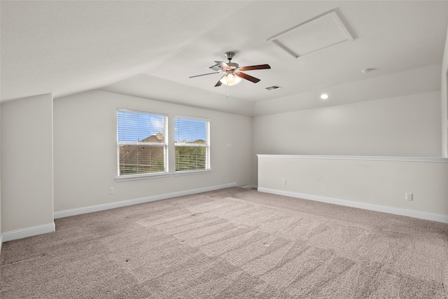 additional living space with light carpet and vaulted ceiling