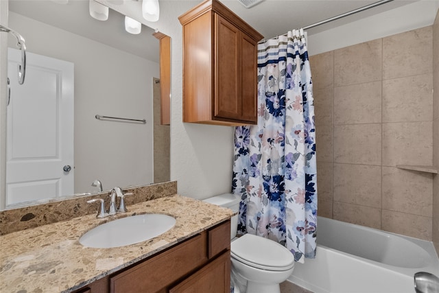 full bathroom featuring vanity, shower / bath combo, and toilet